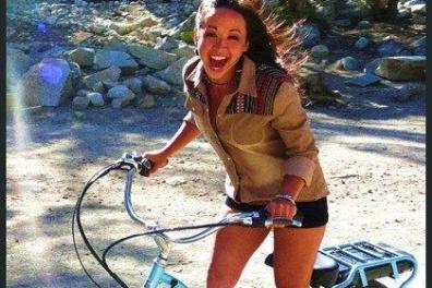 a person riding on the back of a bicycle