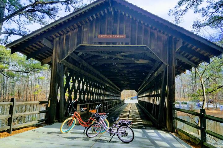 a bicycle is parked next to a bridge