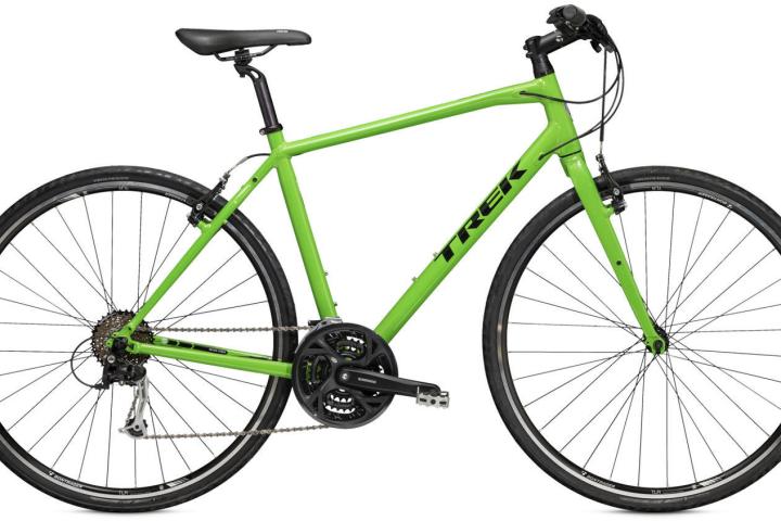 a bicycle leaning against a wall