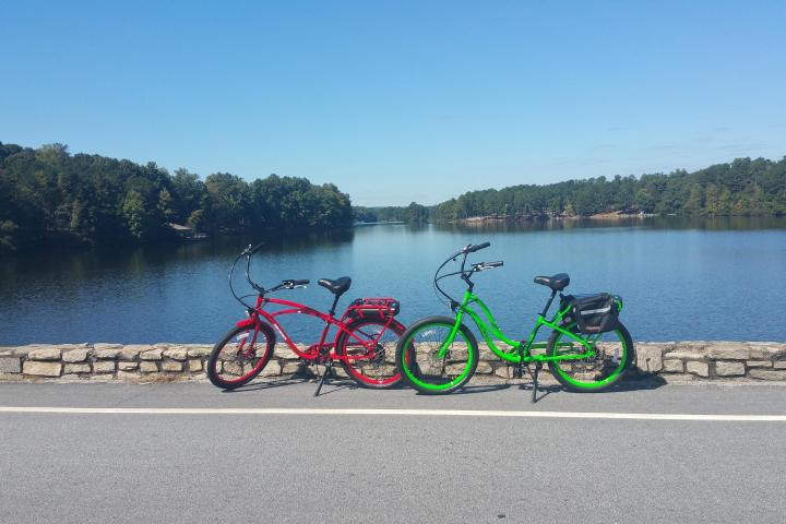 a bicycle parked in front of a body of water